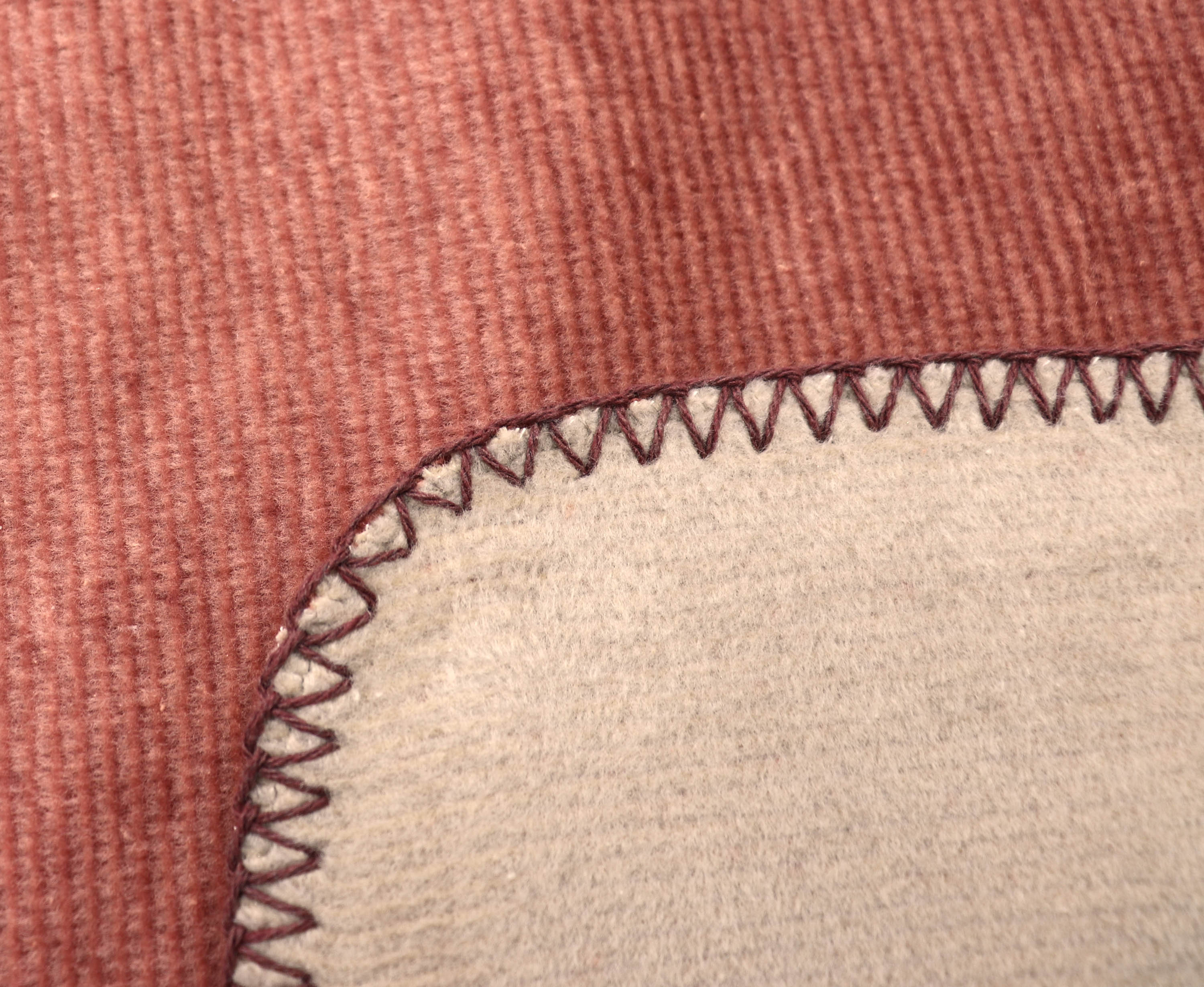 Wohndecke "Melange Doubleface" aus Baumwollmischgewebe in 150x200 cm in Dunkellachs-Karamell - Zierstich